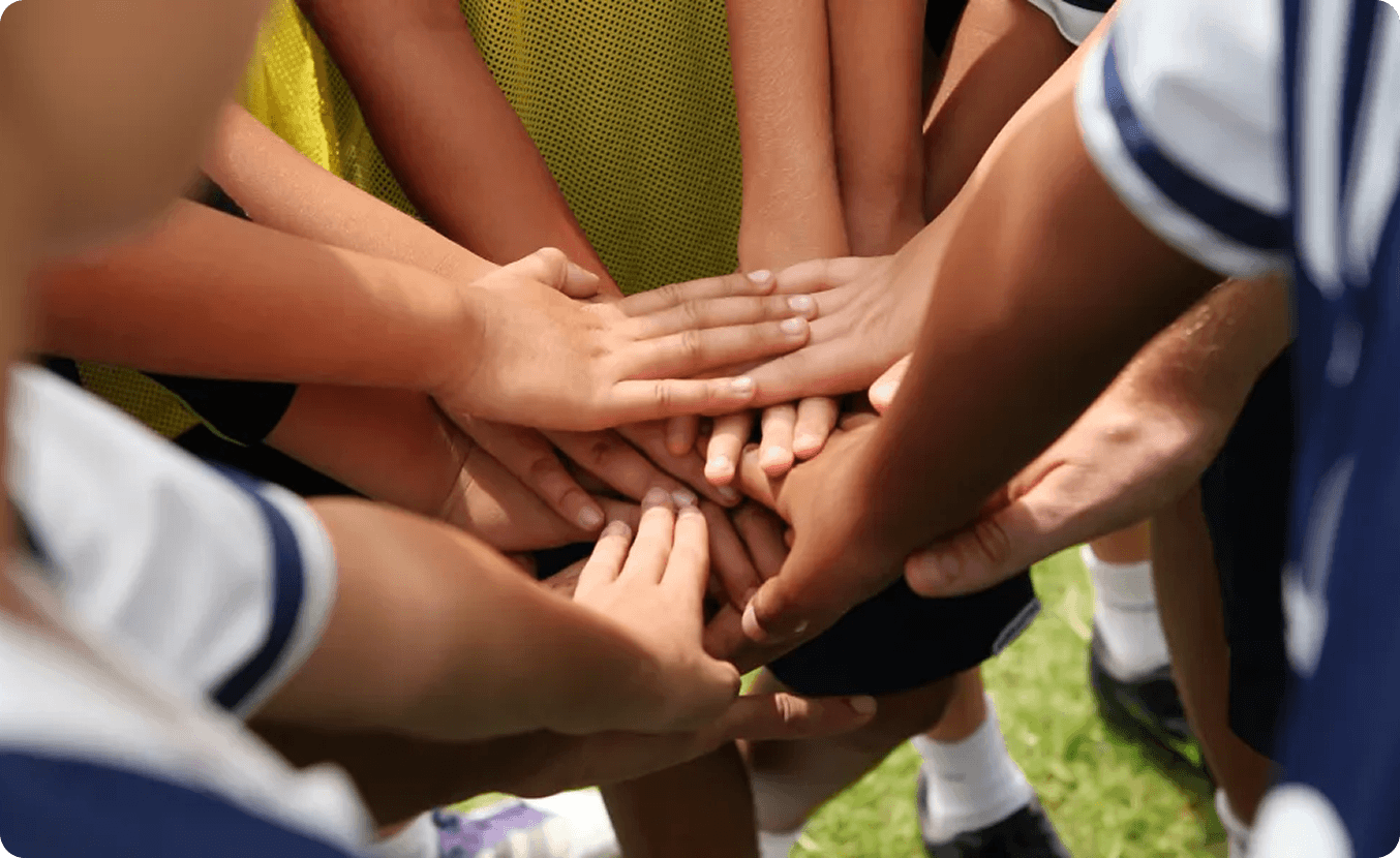 Group of hands joined in teamwork