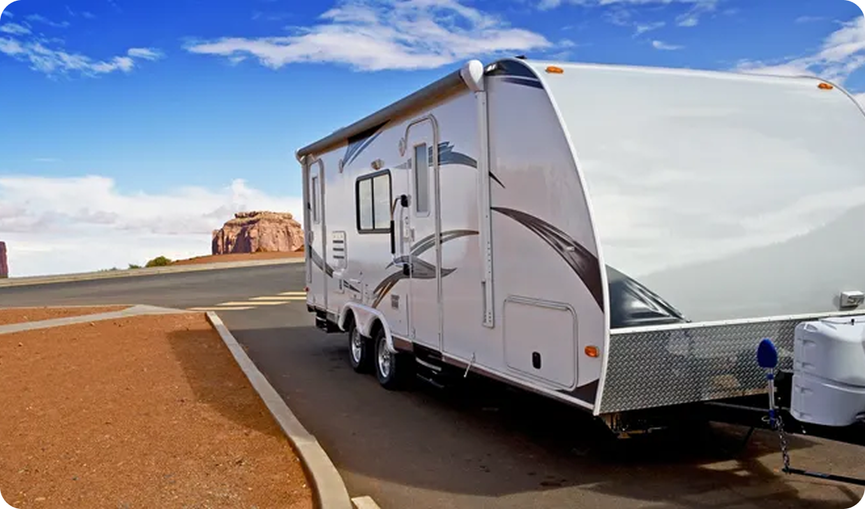 RV on roadside with blue sky