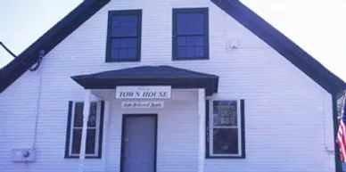 White building with "Town House" sign